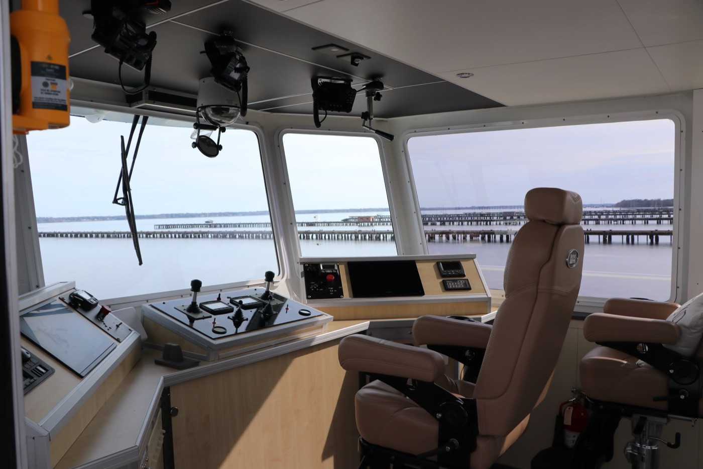 The wheelhouse with helm controls, chart display and captain's chair